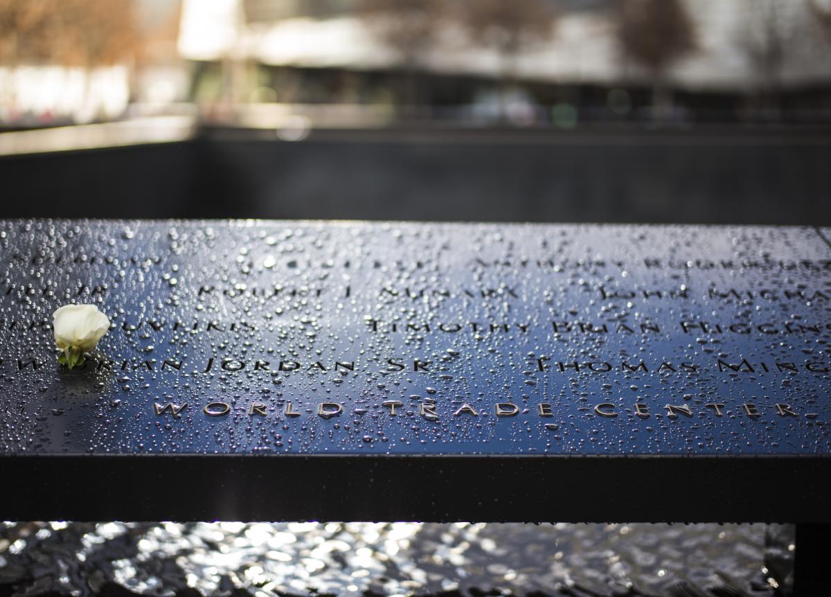 A white rose is placed on the 9/11 Memorial pools at the names of the victims whose birthdays would have been celebrated on that day. Photo by Jin Lee.