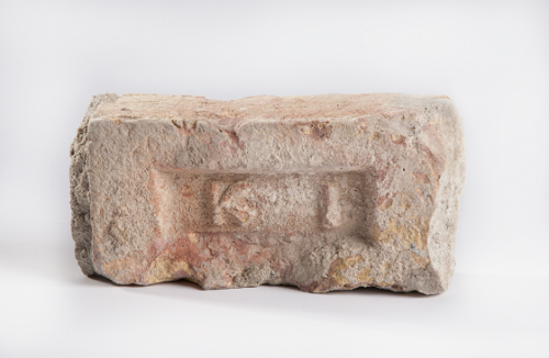 Brick from bin Laden's compound in Pakistan. Collection 9/11 Memorial Museum, photo by Matt Flynn. 