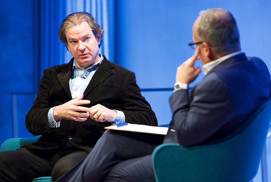 CNN National Security Analyst Peter Bergen speaks onstage at the 9/11 Memorial Museum Auditorium. Clifford Chanin, the executive vice president and deputy director for museum programs, sits beside him with a clipboard on his lap.