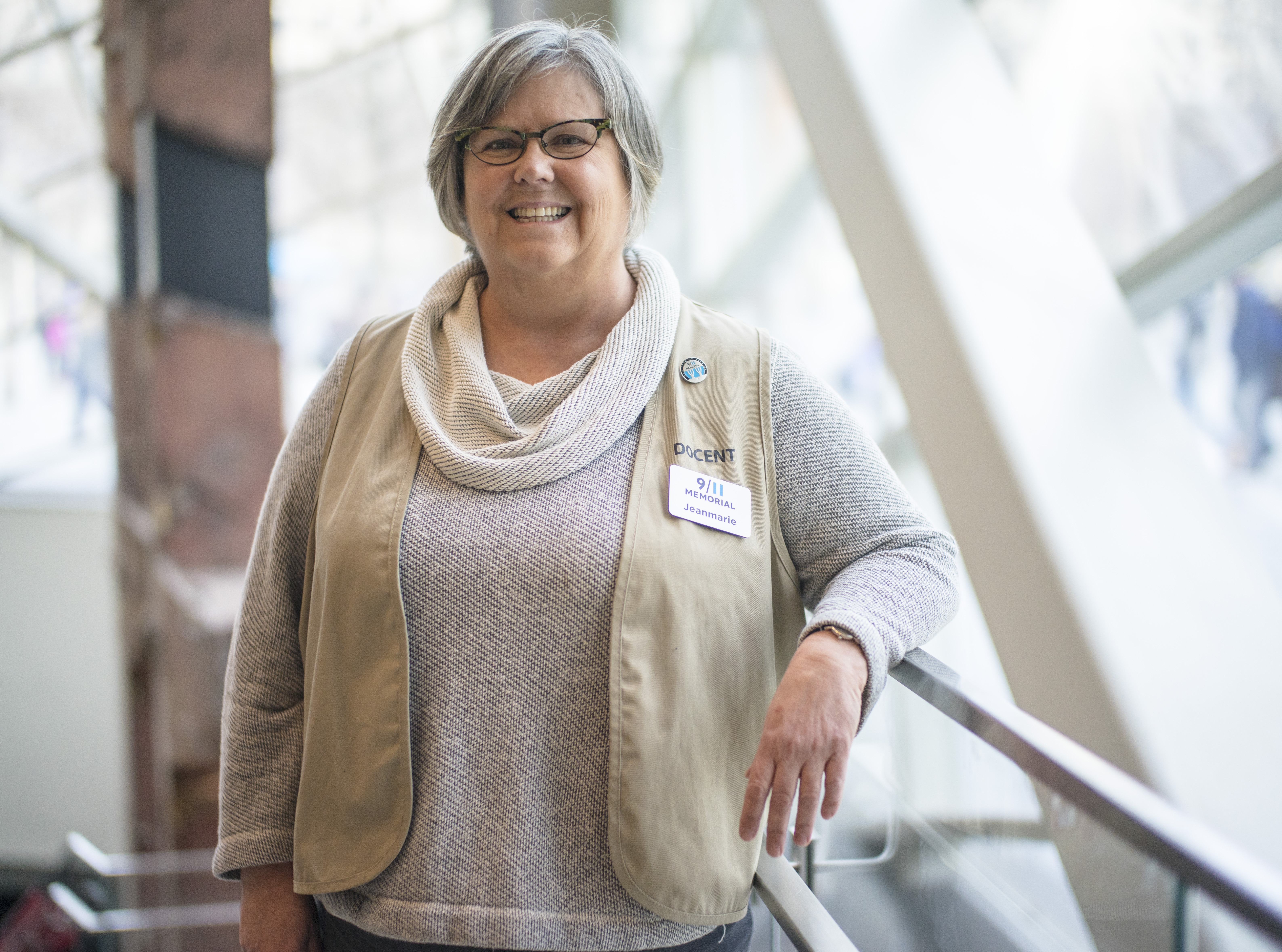 Docent Jeanmarie Hargrave poses for a photo on the ground level of the 9/11  Memorial Museum.