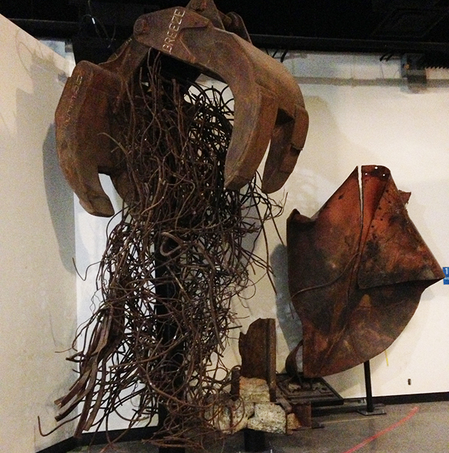 A grappler claw and tangled steel and other debris from the World Trade Center are seen at the Museum before its opening.