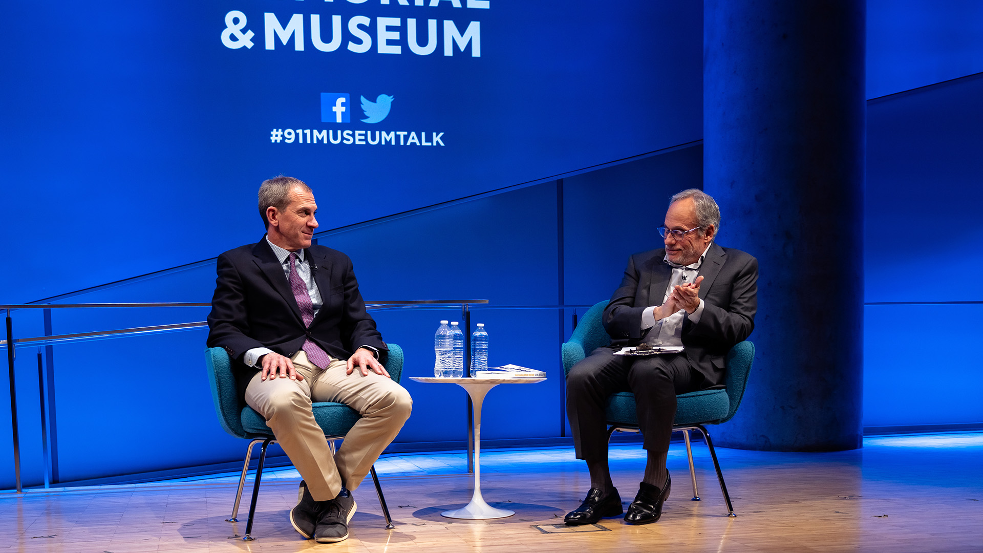 Col. Liam Collins (left) on stage with Clifford Chanin