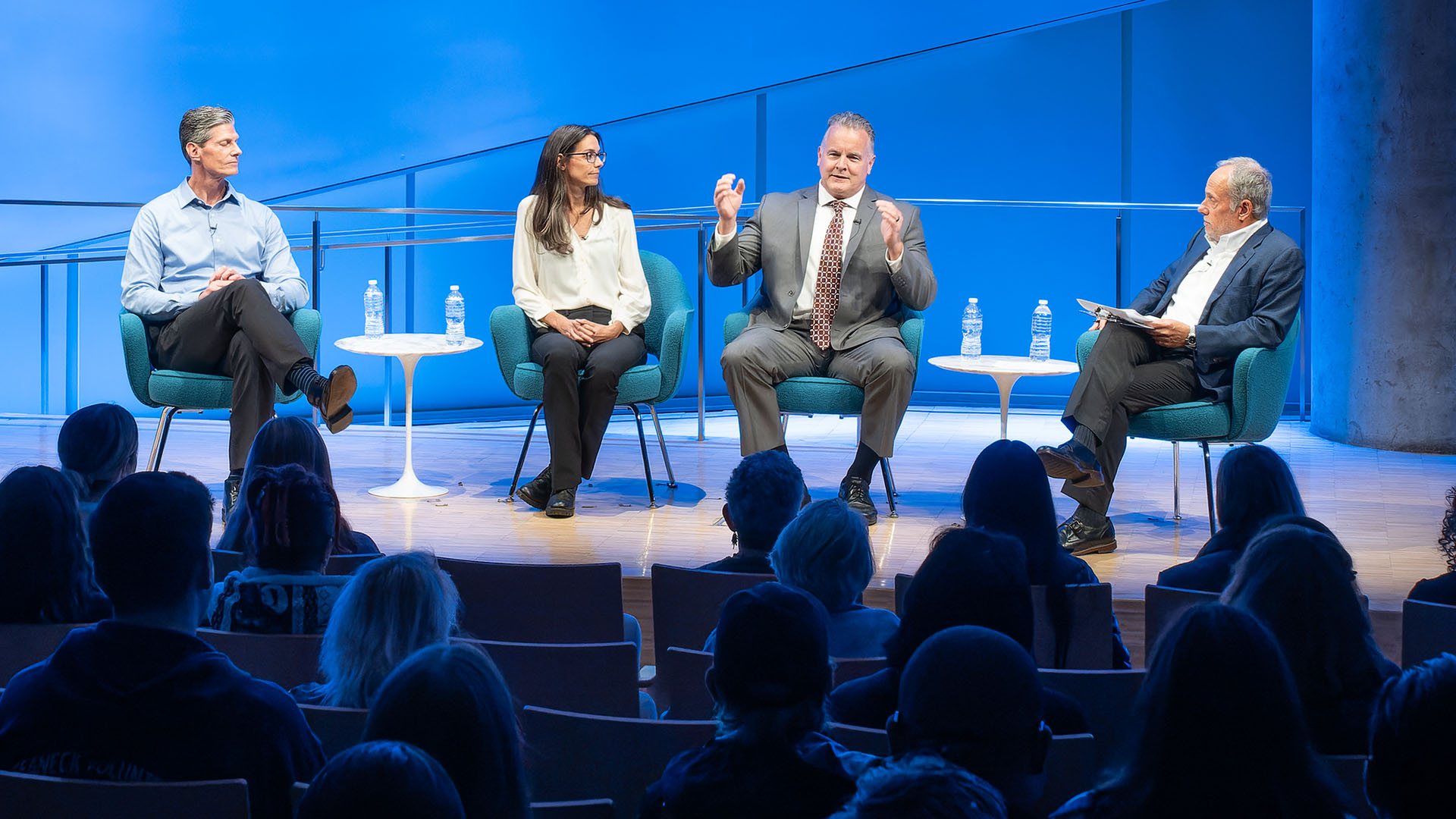 From left: Carl D. Gajewski, Jennifer K. Odien, Mark Desire and Clifford Chanin seated on stage