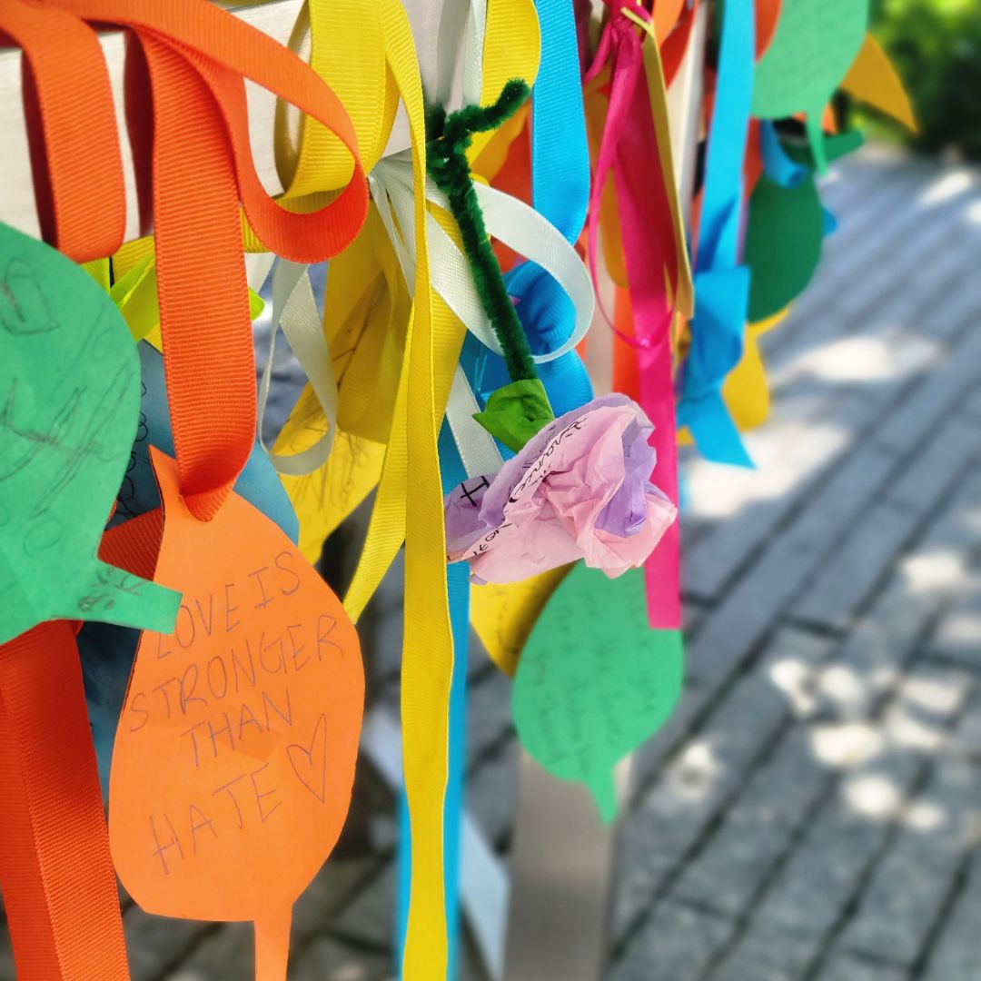 Colorful messages and notes adorning the Survivor Tree