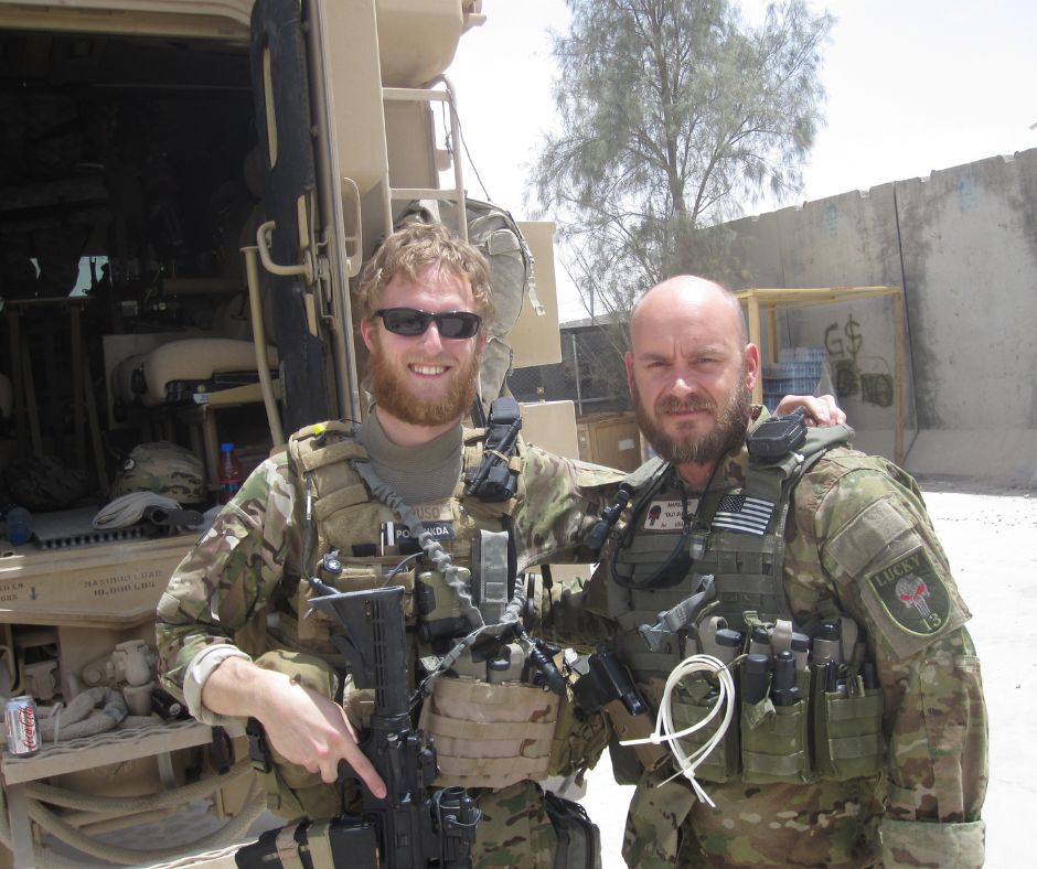 Phil Caruso (left) in uniform with fellow servicemember