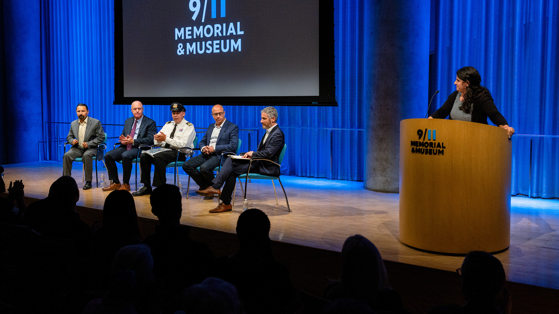 From left: Gulmar Parga, John Hillin, Richard Thornton, Eddie Rosenstein and Noah Rauch on stage with Dahlia Azran at the podium.