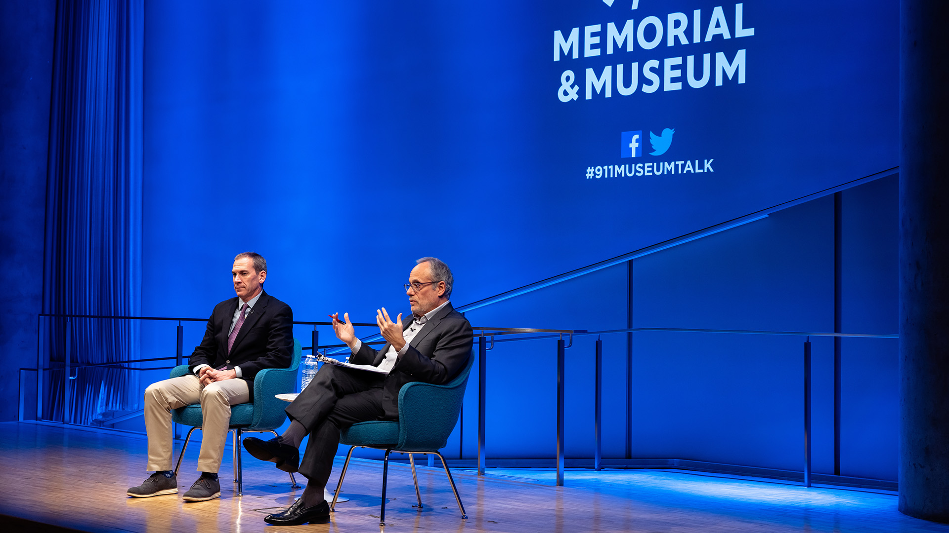 Col. Liam Collins (left) on stage with Clifford Chanin