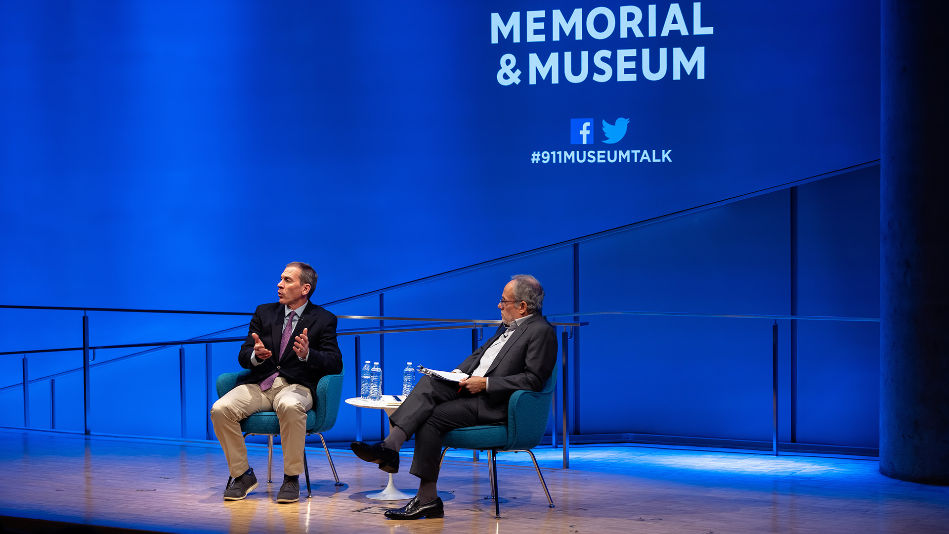 Col. Liam Collins (left) on stage with Clifford Chanin