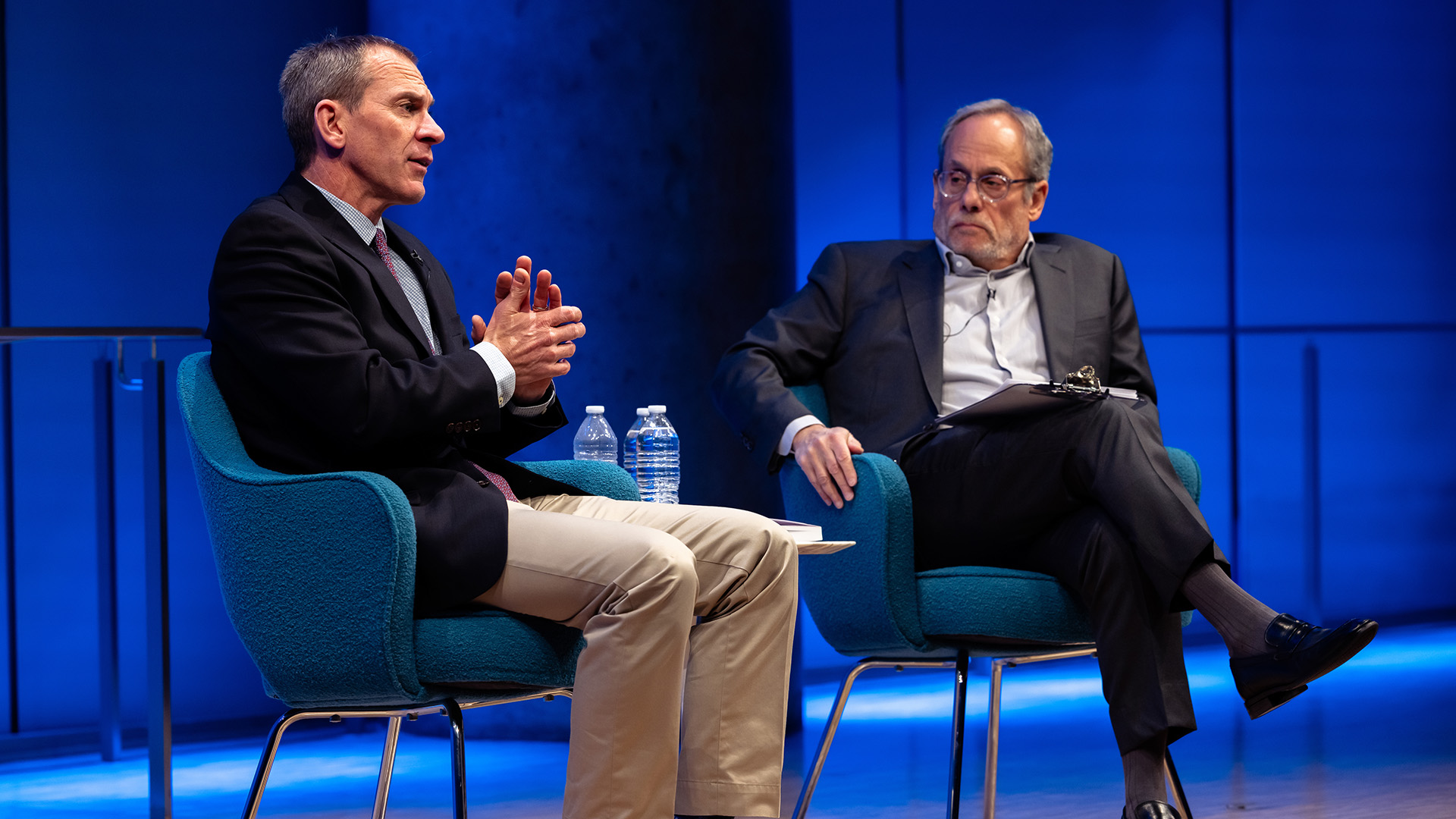 Col. Liam Collins (left) on stage with Clifford Chanin