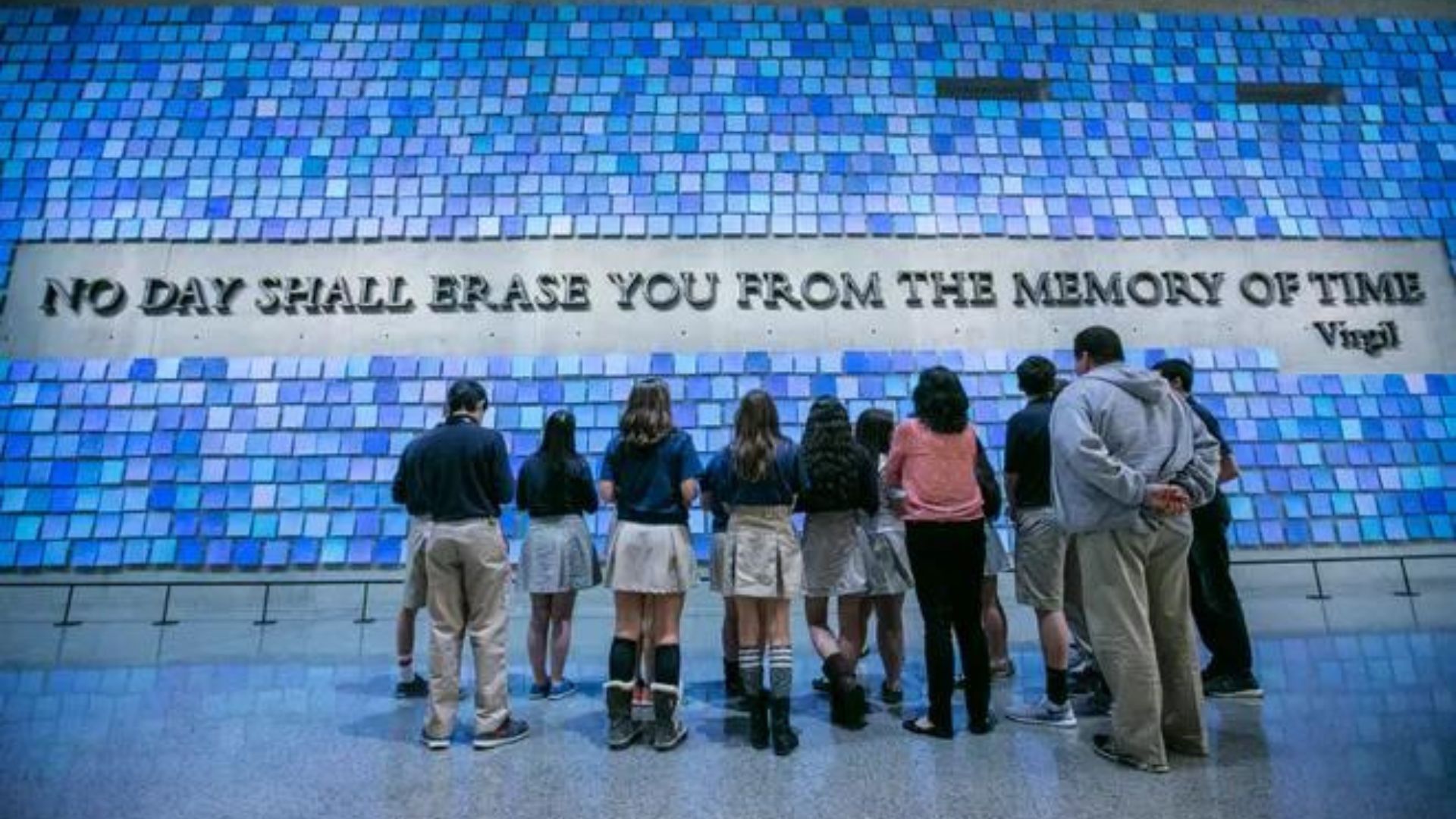 Back view of a group of students looking at the Spencer Finch installation "Trying to Remember the Color of the Sky on That September Morning" 