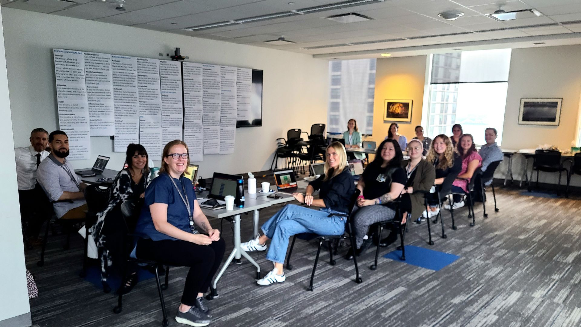 Museum staff gathers seated in preparation for the 2023 Digital Learning Experience live chat