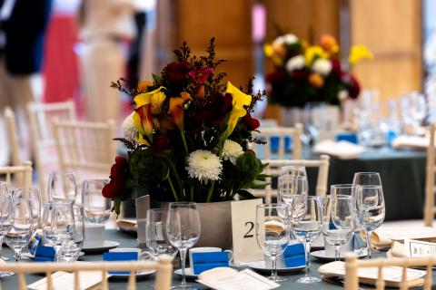 a table is set with crystal and flowers 