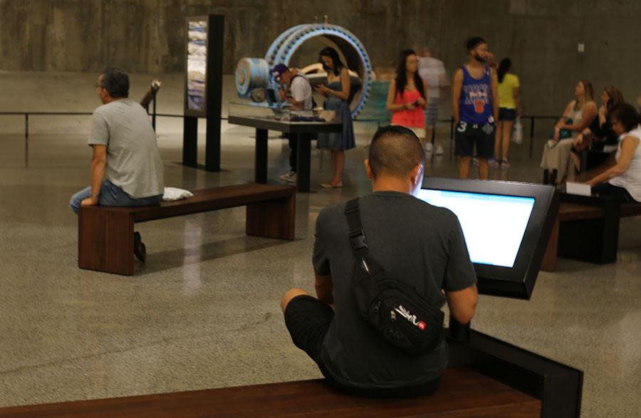 A visitor accesses the online registries on a touchscreen in Foundation Hall.