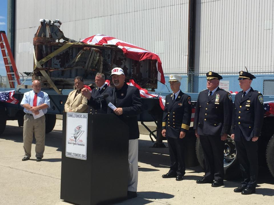 Frank Siller, chairman and CEO of the Stephen Siller Tunnel to Towers Foundation addresses a crowd during a ceremony marking the removal of the final 9/11 artifacts from a Hangar 17 at John F. Kennedy International Airport.