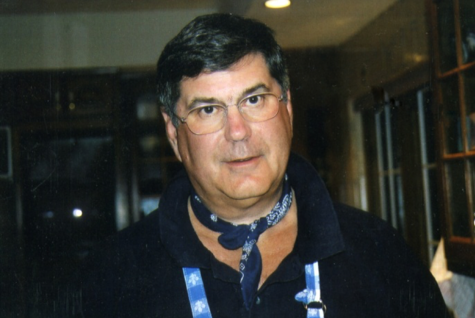 Charles Zion smiles in this family photo. One of his signature bandanas is seen wrapped around his neck.